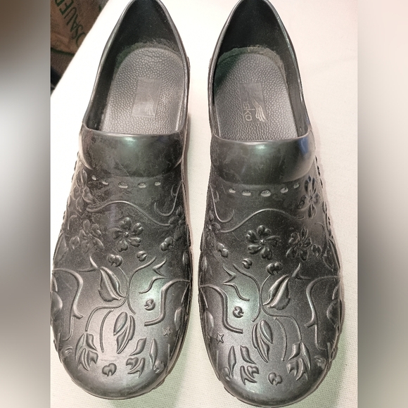 Elegance in Every Step: Embossed Floral Black Clogs by Dansko (#1,230) - Picture 1 of 6
